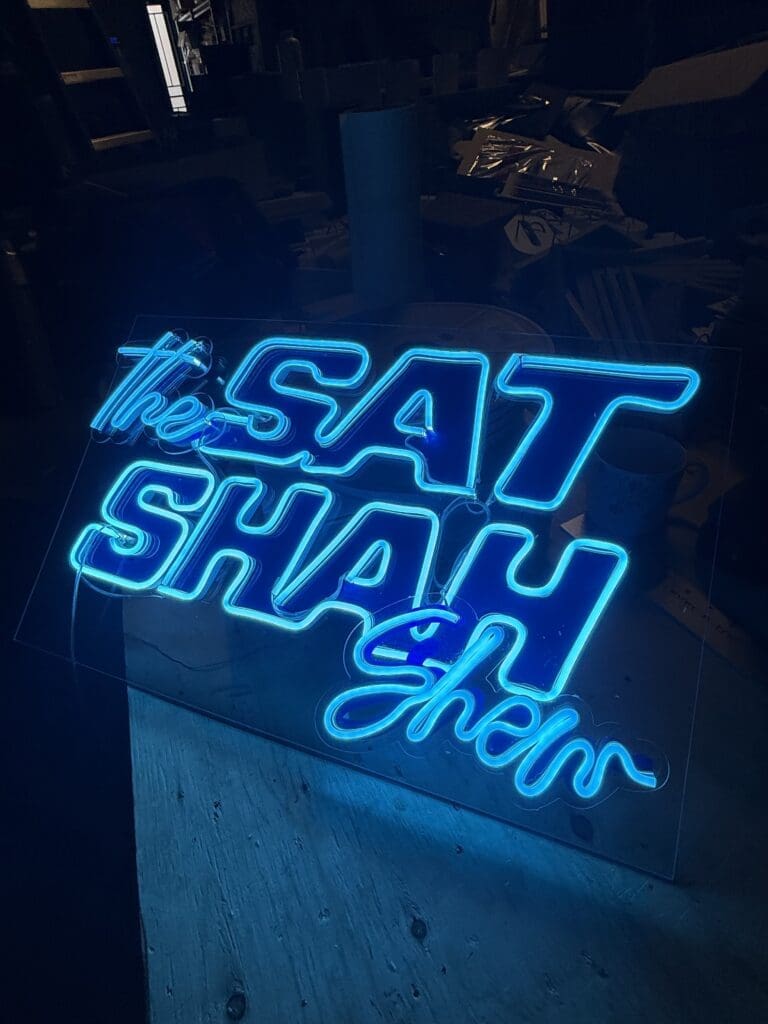 Finished 30 by 18 inch aqua blue neon sign for The Sat Shah Show by Sick Media